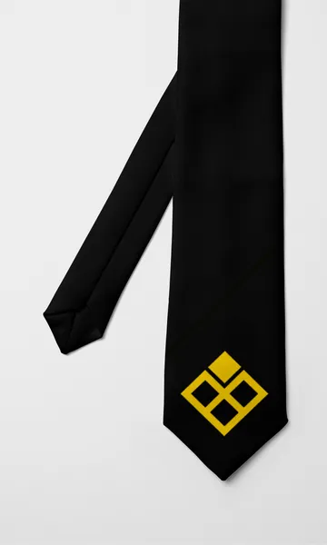 Corbata negra con el símbolo amarillo de Vink en la punta